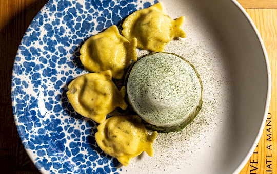 Gallery Delights - Fish ravioli Fish ravioli, vegetable reduction and mollusks emulsion